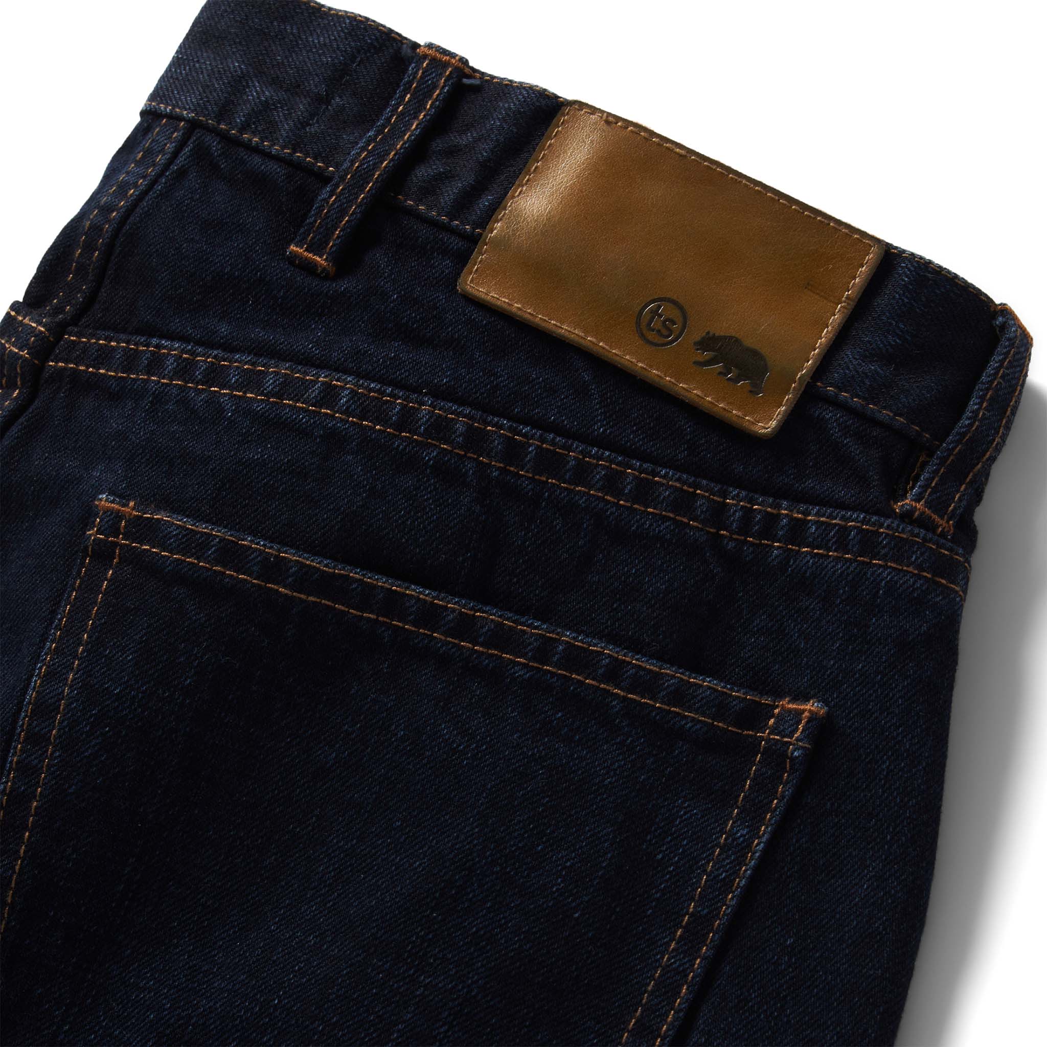 material shot of the logo pocket on The Slim Jean in Wallace Wash Organic Selvage, Bottoms by Taylor Stitch