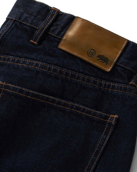 material shot of the logo pocket on The Slim Jean in Wallace Wash Organic Selvage, Bottoms by Taylor Stitch