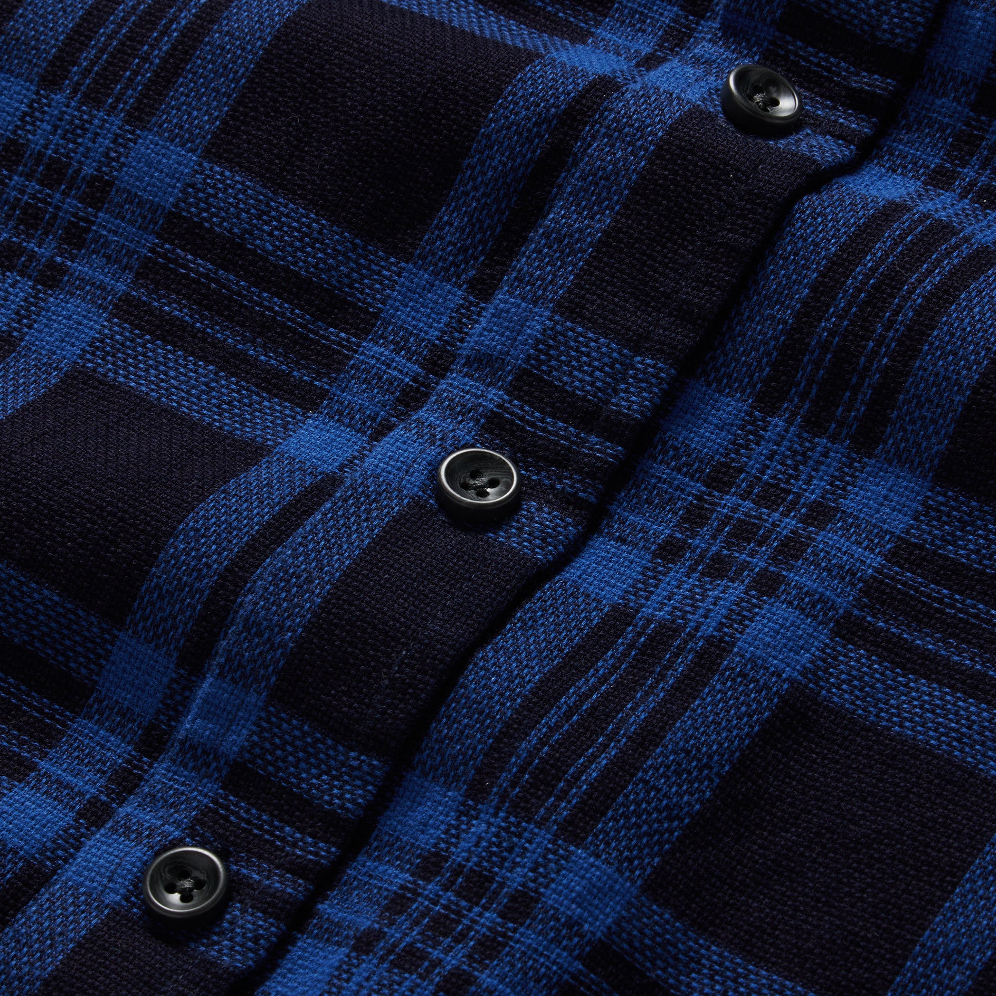 material shot of the buttons on The Utility Shirt Rinsed Indigo Plaid, Wovens by Taylor Stitch