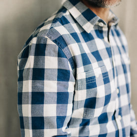 fit model posing wearing The Utility Shirt in Sun Bleached Indigo Check