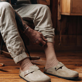 fit model adjusting The Waffle Sock in Dried Acorn