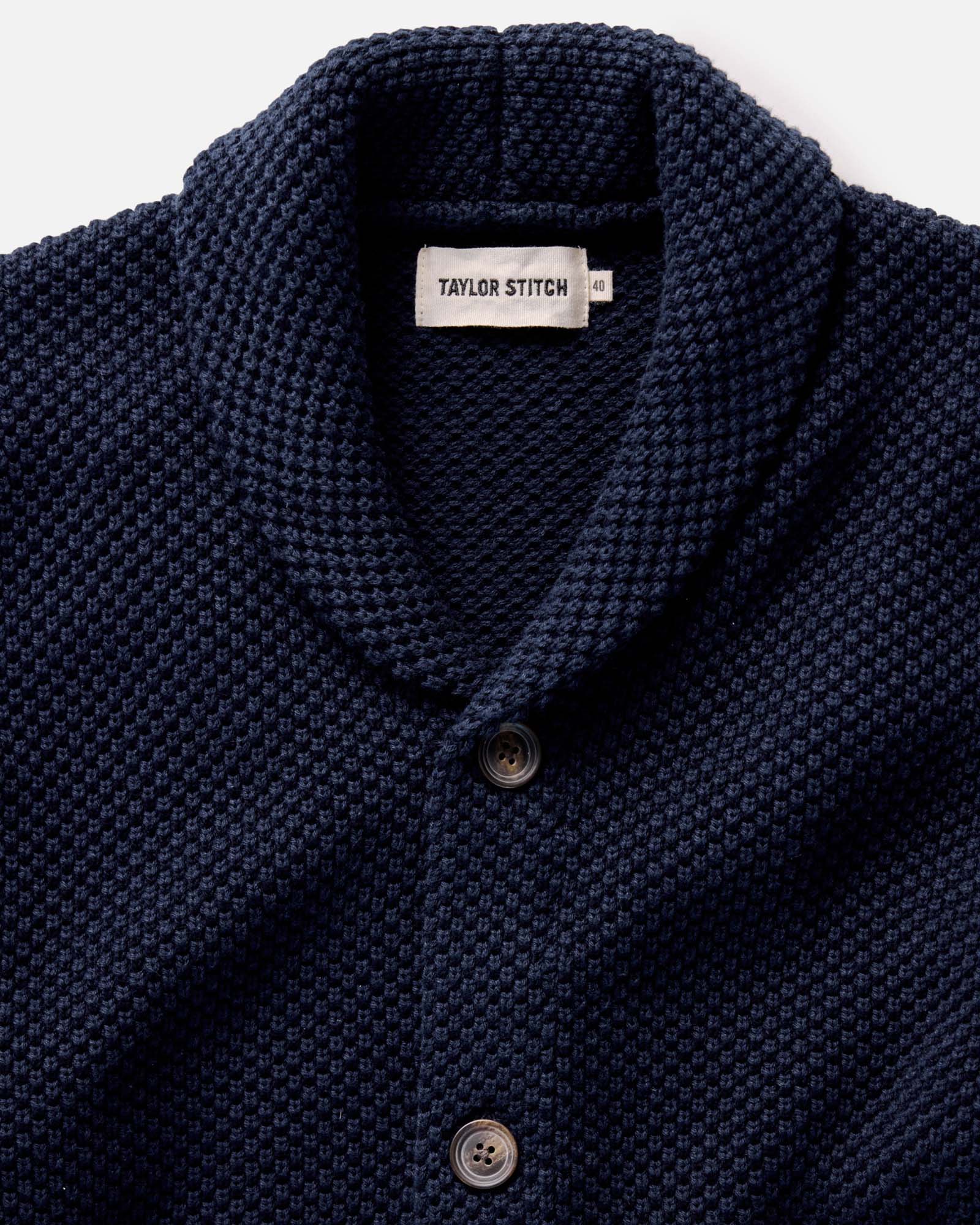 fit model rocking the The Crawford Sweater in Navy, standing by a car, Knits by Taylor Stitch