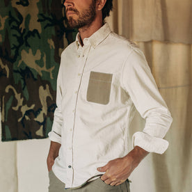fit model wearing The Atelier and Repairs Jack in Washed White Oxford, cuffed, hands in pockets