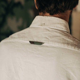 fit model wearing The Atelier and Repairs Jack in Washed White Oxford, back detail
