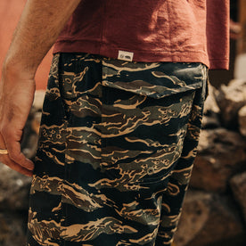 fit model wearing The Adventure Short in Tiger Camo, side profile