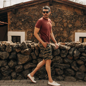 fit model wearing The Adventure Short in Tiger Camo, walking right