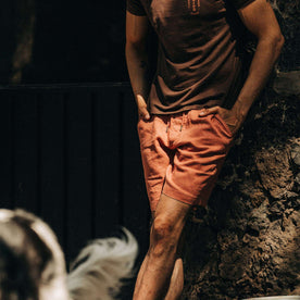 fit model wearing The Apres Short in Rust Hemp, hands at sides, chest down