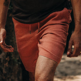 fit model wearing The Apres Short in Rust Hemp, hands at sides