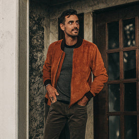 fit model wearing The Bomber Jacket in Whiskey Suede, hands in pockets