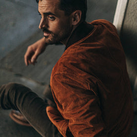 fit model wearing The Bomber Jacket in Whiskey Suede, side profile