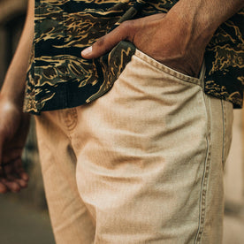 fit model wearing The Camp Pant in Khaki Herringbone, hand in pocket, cropped up close