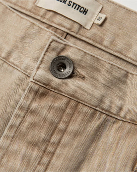 material shot of button, Bottoms by Taylor Stitch