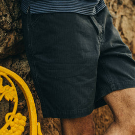 fit model wearing The Camp Short in Navy Herringbone, cropped of right leg