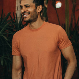 fit model wearing The Cotton Hemp Tee in Sunburn, smiling, looking left