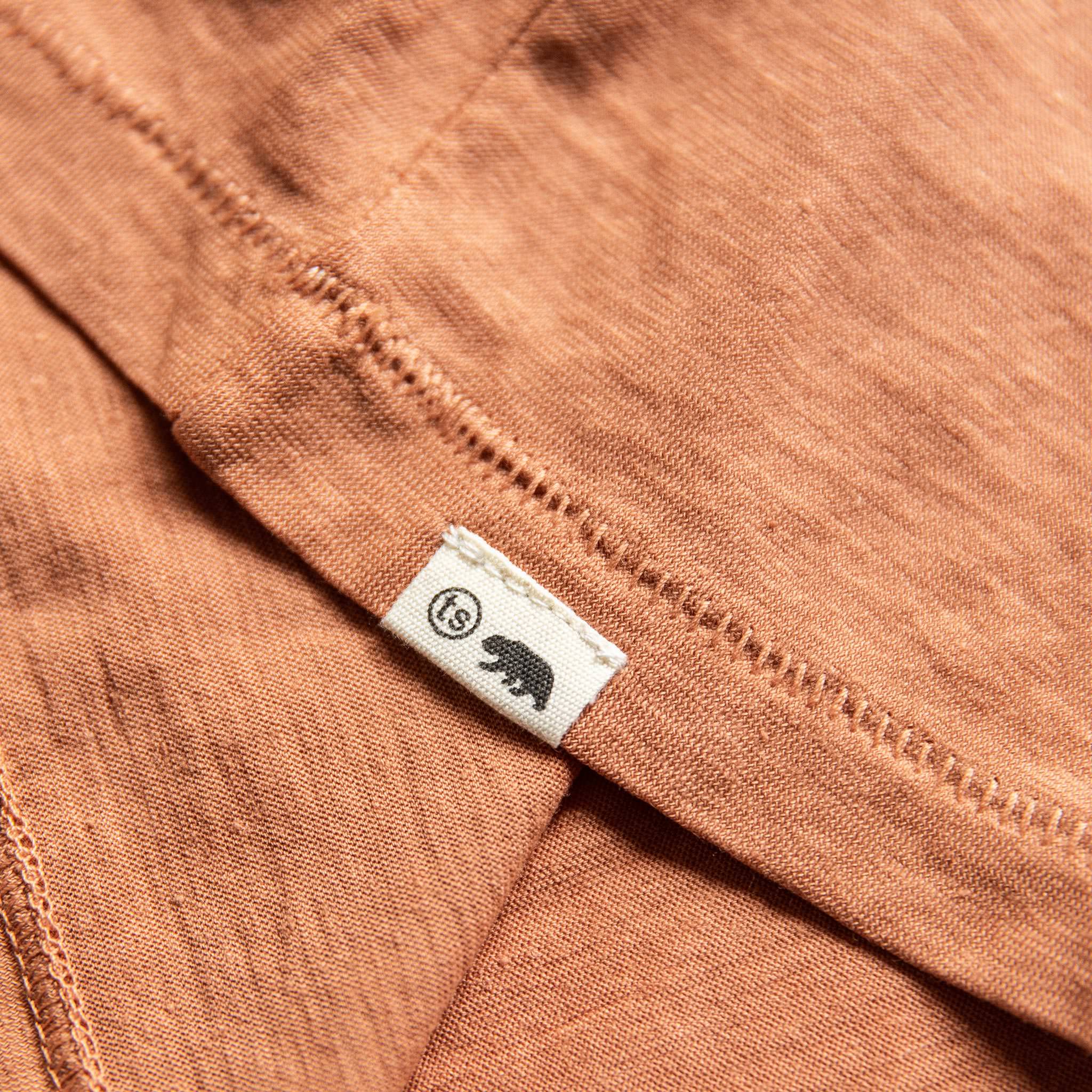 material shot of logo on bottom, Knits by Taylor Stitch