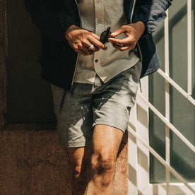 fit model wearing The Easy Short in Navy Herringbone, cropped shot chest down