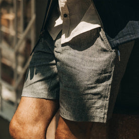 fit model wearing The Easy Short in Navy Herringbone, up close, left side