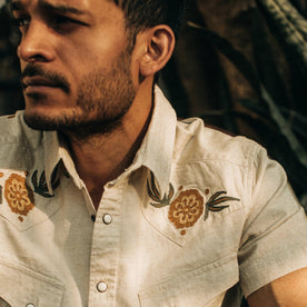 fit model wearing The Embroidered Short Sleeve Western in Natural, cropped chest shot