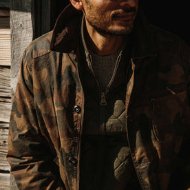 fit model wearing The Field Jacket in Camo over a vest