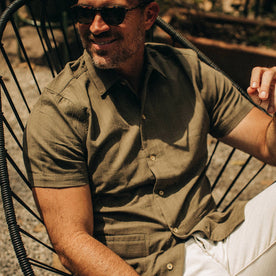 fit model wearing The Havana in in Olive Jacquard Stripe, sitting in chair