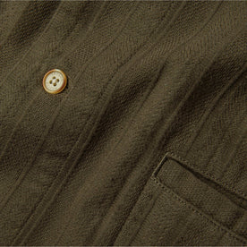 material shot of chest pocket and button