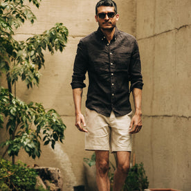 fit model wearing The Jack in Espresso Linen paired with shorts, looking at camera