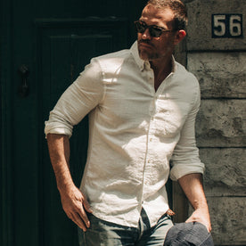 fit model wearing The Jack in Natural Linen, looking left