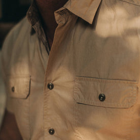 fit model wearing The Short Sleeve Officer Shirt in Khaki, chest detail