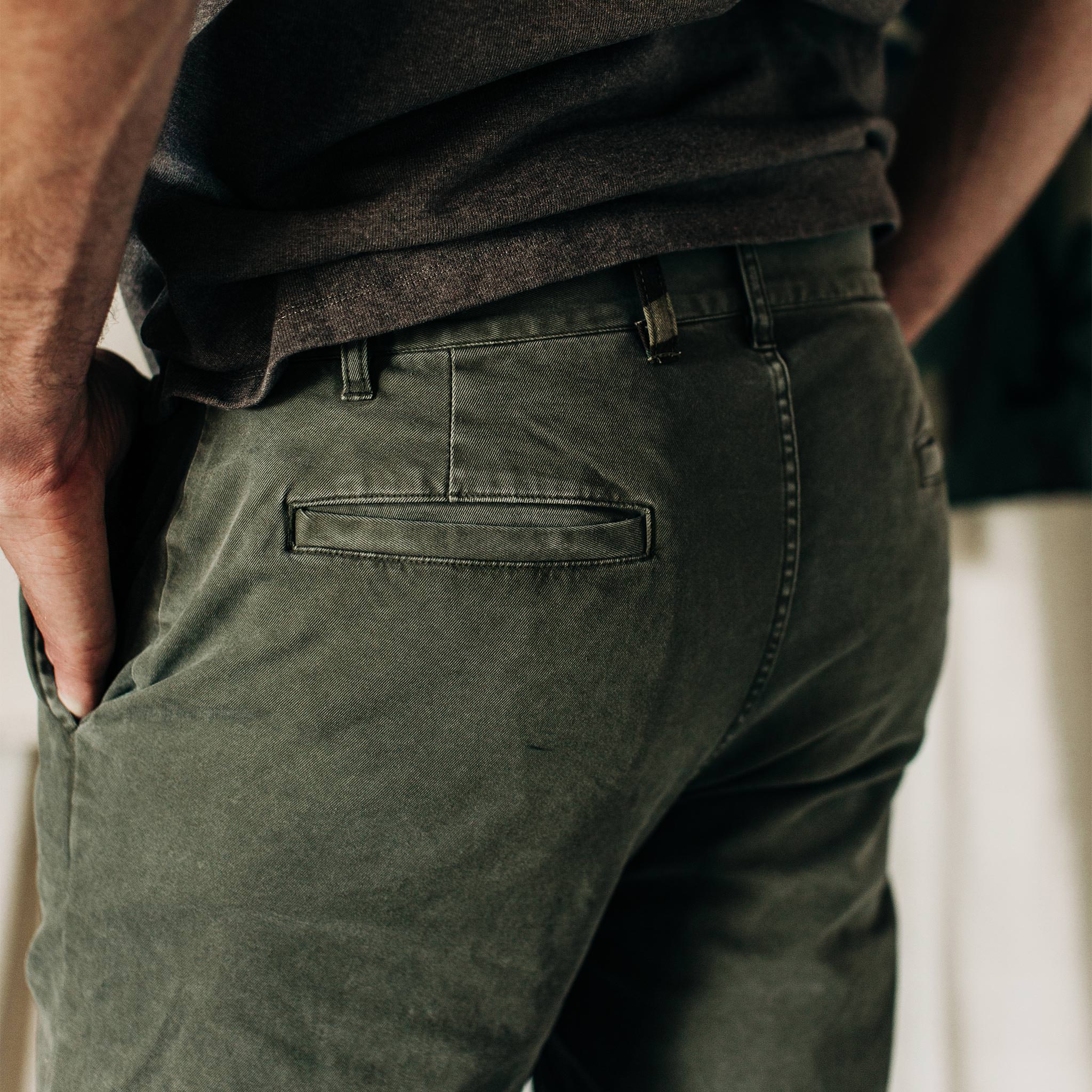 material shot of The Atelier and Repairs Chino in Olive, side shot on model, Bottoms by Taylor Stitch