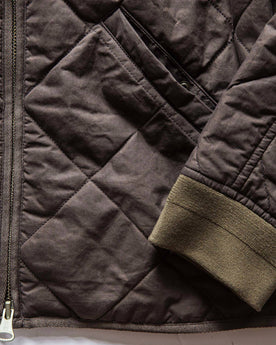 material shot of The Quilted Bomber Jacket in Espresso, front pocket and sleeve, Outerwear by Taylor Stitch