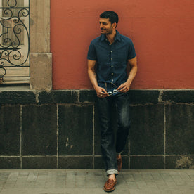 fit model wearing The Short Sleeve California in Indigo Jacquard Stripe, looking left of camera