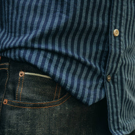 fit model wearing The Short Sleeve California in Indigo Jacquard Stripe, paired with dark denim