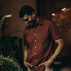 fit model wearing The Short Sleeve California in Rust Pique, looking down