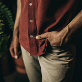 fit model wearing The Short Sleeve California in Rust Pique, hand in pocket