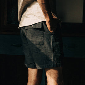 fit model wearing The Trail Short in Navy Reverse Sateen, right hand in pocket