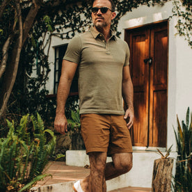fit model wearing The Trail Short in Tobacco, walking right