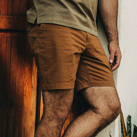 fit model wearing The Trail Short in Tobacco, cropped chest down