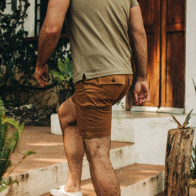 fit model wearing The Trail Short in Tobacco, back shot