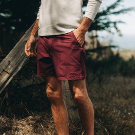 fit model wearing The Traverse Short in Wine, hand in pocket