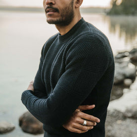 fit model wearing The Ventana Sweater in Navy with his arms crossed