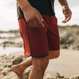 fit model walking on the beach in The Anchor Trunk in Red Clay