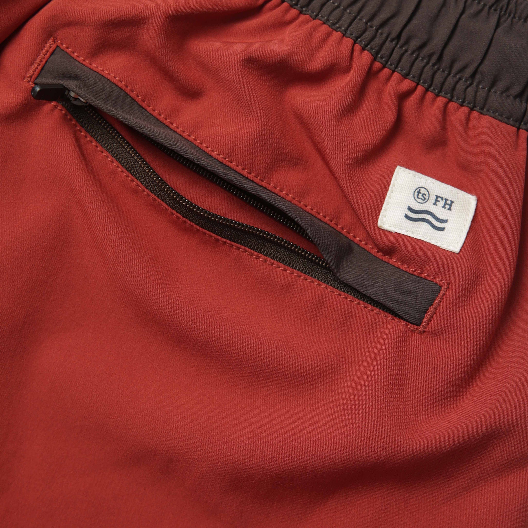 material shot of the back zipper pocket on The Anchor Trunk in Red Clay, Bottoms by Taylor Stitch