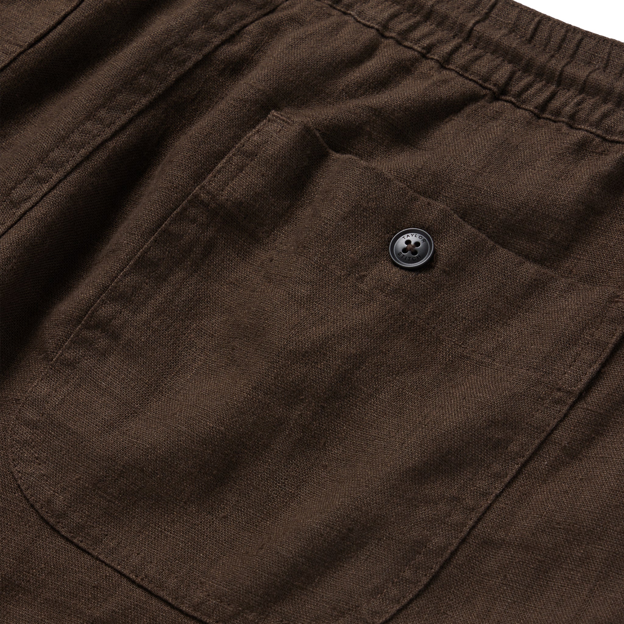 material shot of the rear pocket on The Apres Short in Espresso Hemp, Shorts by Taylor Stitch