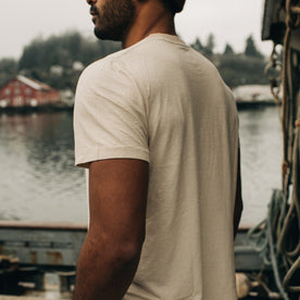 fit model walking on a boat in The Cotton Hemp Tee in Sand