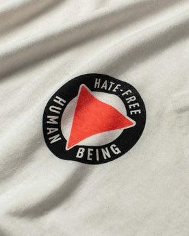 material shot of close-up of the graphic logo on The Cotton Hemp Tee in Hate-Free, Knits by Taylor Stitch