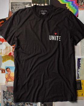 flatlay of The Cotton Hemp Tee in Unite, against a background of vintage magazines, Knits by Taylor Stitch