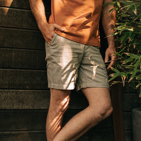 fit model with his hand in the pocket of The Easy Short in Olive Herringbone