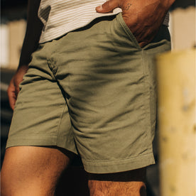 fit model showing a 3/4 view of The Foundation Short in Olive Twill