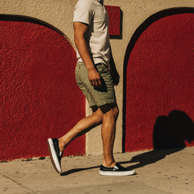 fit model walking in The Foundation Short in Olive Twill