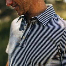 fit model showing the collar and buttons on The Heavy Bag Polo in Navy and Ash Stripe